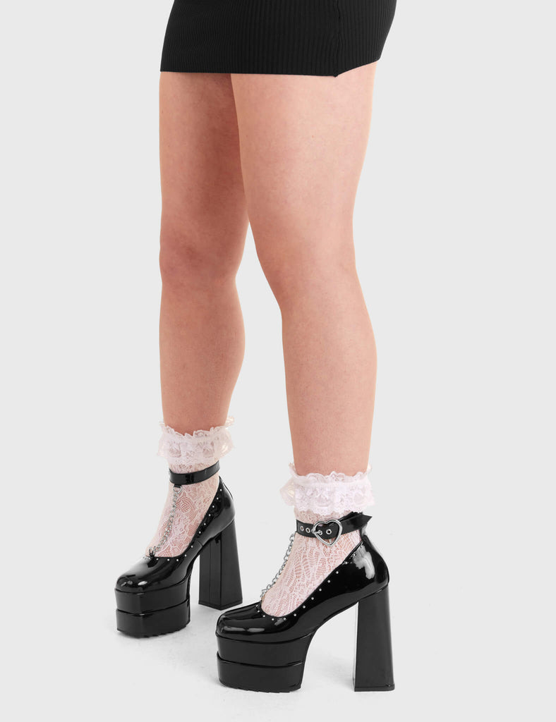 TOGETHER

Binded Platform Heels in Black Patent faux leather. These platform heels feature an adjustable strap that includes silver heart buckle with silver eyelets. Also features a silver hanging chain and silver studs, keeping it nice and classy on our double stack platform sole. Made with eco-friendly materials and these heels are 100% vegan.

- Platform Height
- Silver Buckles
- Silver Eyelets
- Adjustable Strap
- Silver Chain
- Platform Sole
- High Heel
- 100% Vegan

SKU: LMF 3162 - BlackPAT