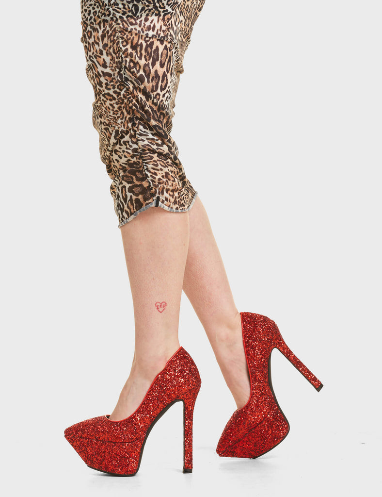 Diamond In The Rough Platform Heels in Red Glitter. Feature a simple and slick design with a pointed toe.