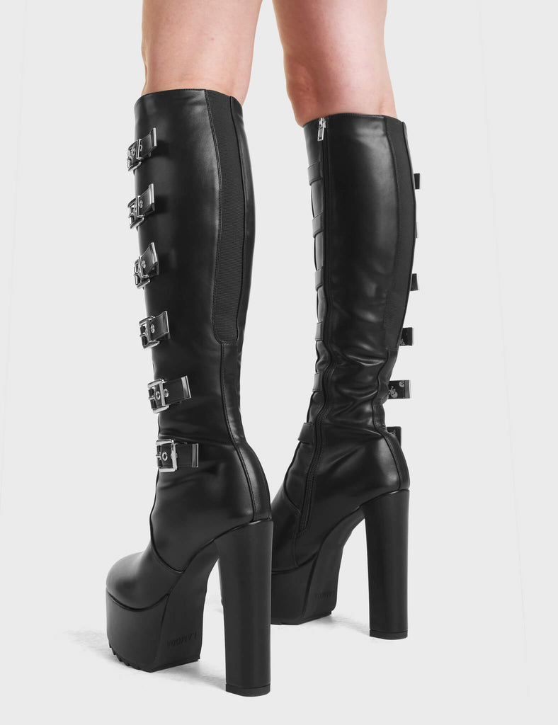 Direct Platform Knee High Boots in Black. Featuring adjustable straps with Silver buckles running up the leg.