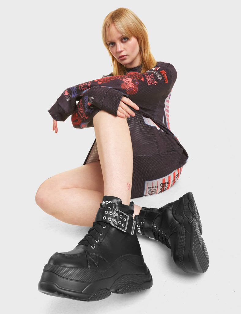 Eerie Chunky Platform Sneakers in Black with 'LAMODA' in white on the tongue of the shoe.