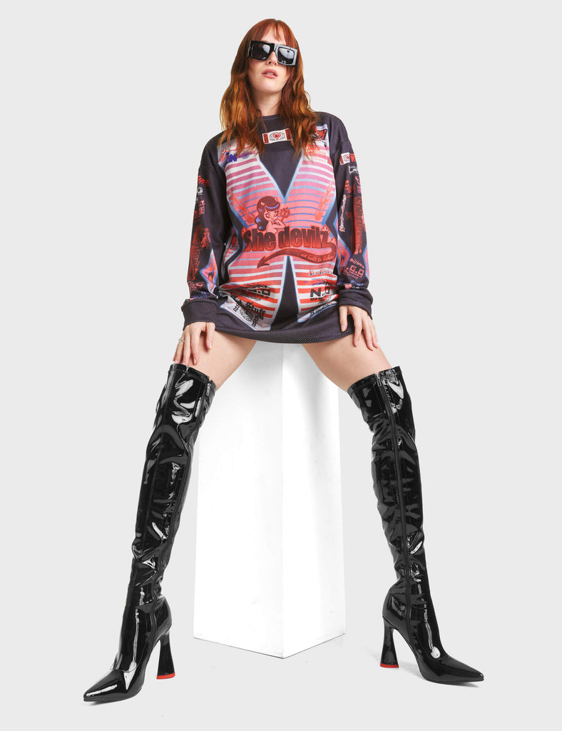 Ego Platform Thigh High Boots in Black Patent. These Thigh High Boots feature a pointed toe and a heart shaped heel.