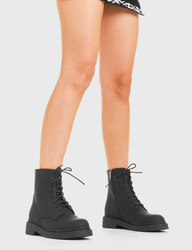 In a While Ankle Boots in Black. Features include Black Laces.