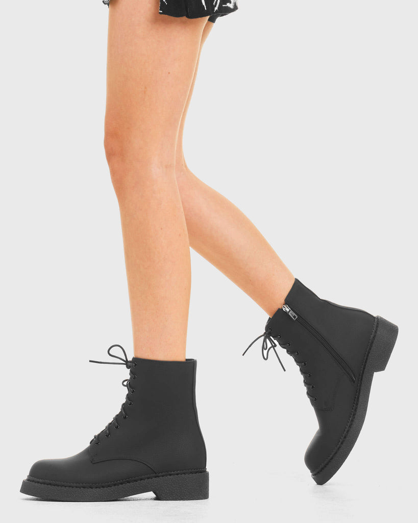 In a While Ankle Boots in Black. Features include Black Laces.