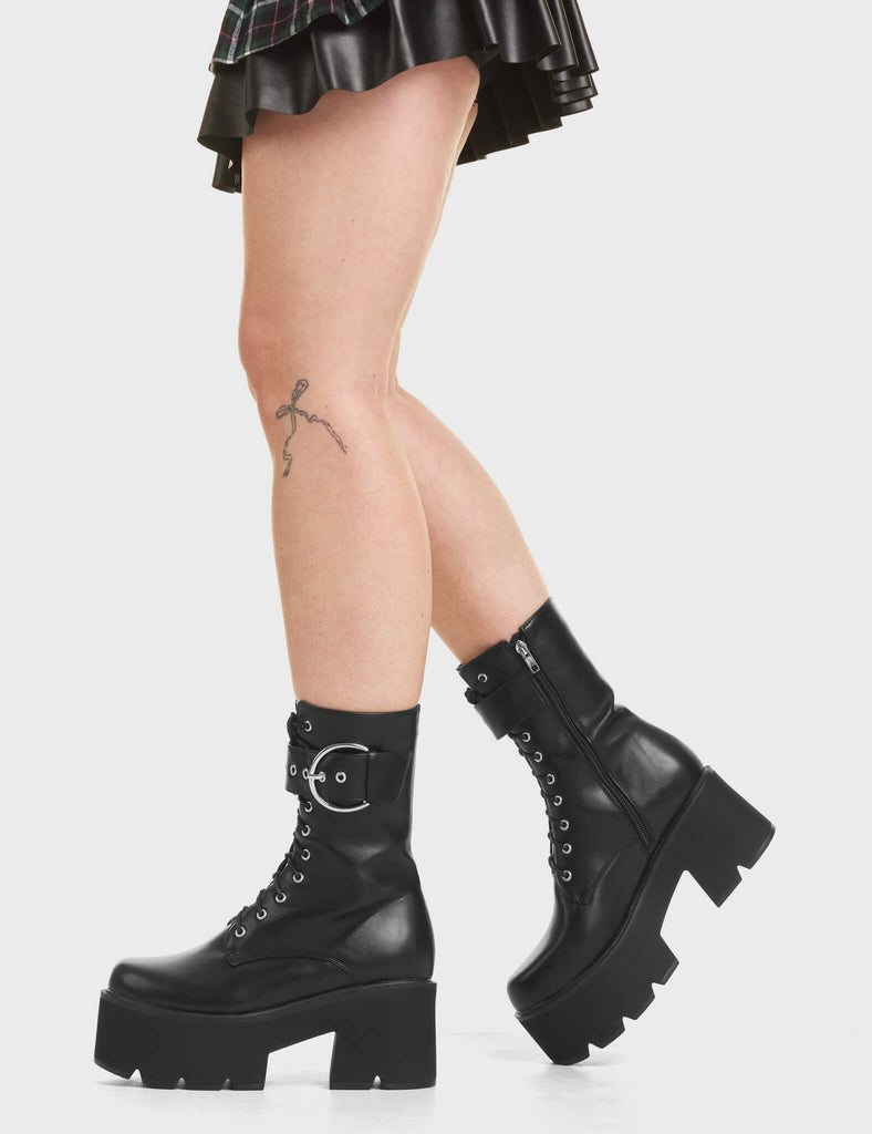 Injustice Chunky Platform Ankle Boots in Black. Featuring a lace-up design.