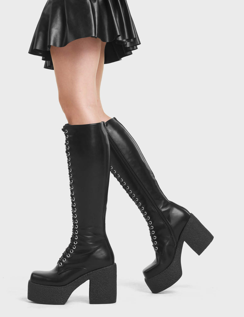 Tackle your day with On Smoke Platform Knee High Boots in Black. Platform Knee High Boots with a rubber platform sole. 100% vegan friendly Boots. 
