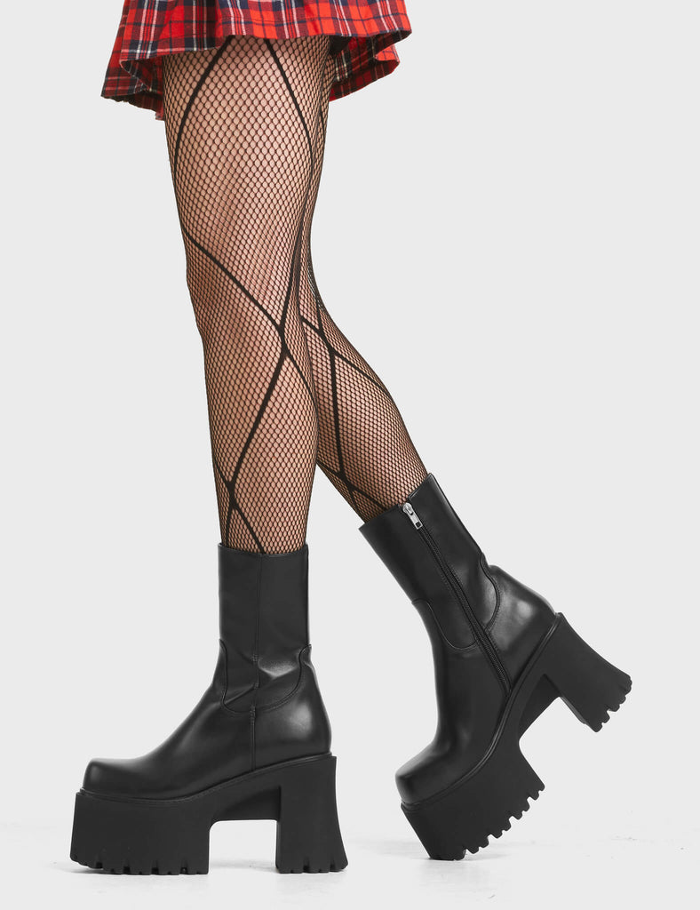 Rational Chunky Platform Ankle Boots in Black. Feature a minimalistic design on a chunky tread platform sole.